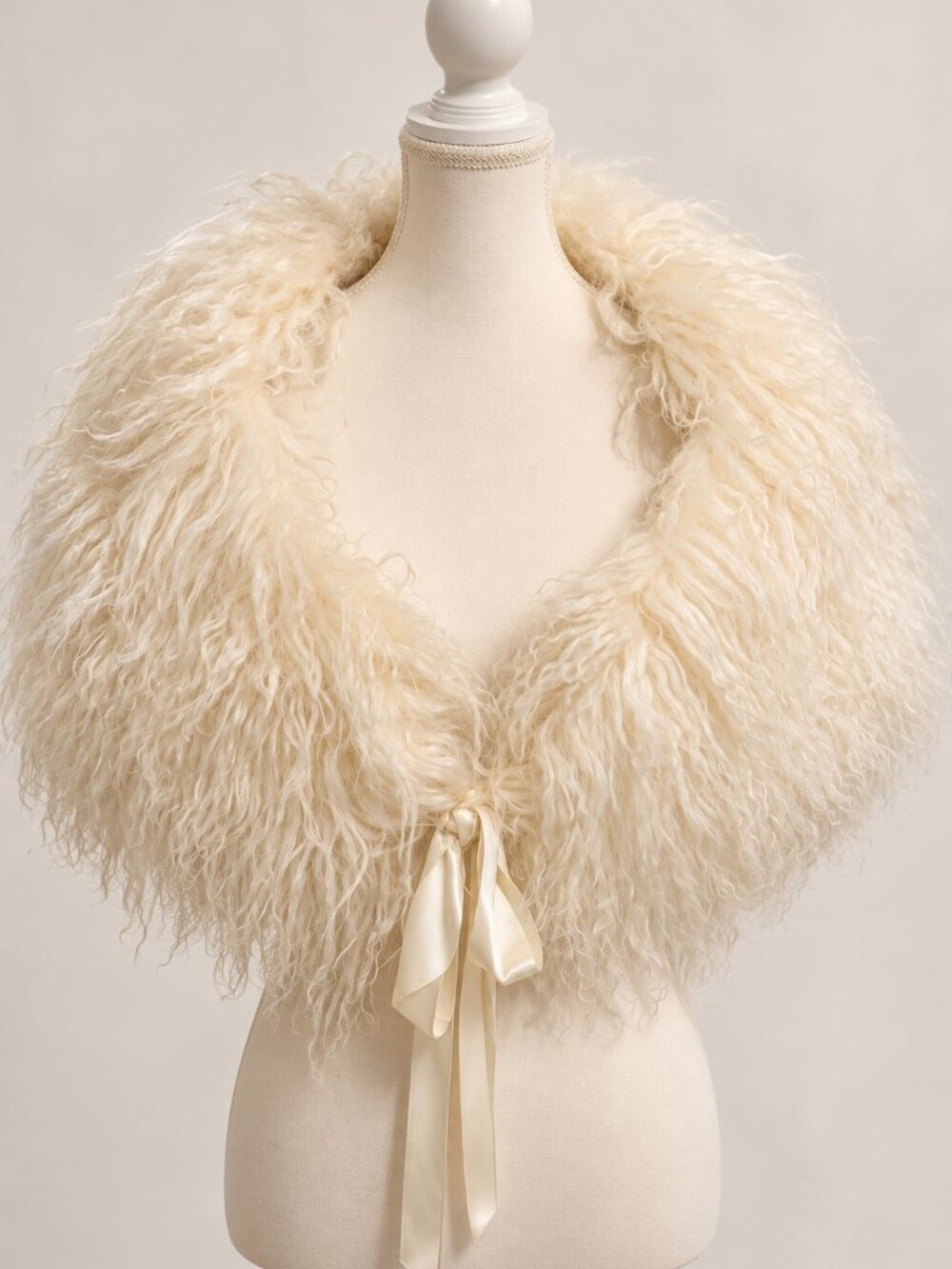 Elegant ivory genuine lamb fur shrug/capelet with long curly texture and satin r